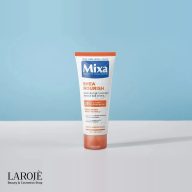 کرم دست و ناخن میکسا Shea Nourish روی میز